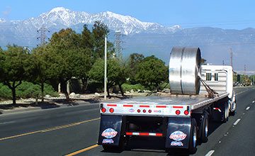 4000A<em>E</em> Flatbed Rear View Hauling Steel Coil